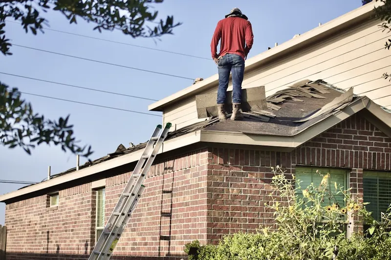 Professional roofer working on a residential roof in Chantilly